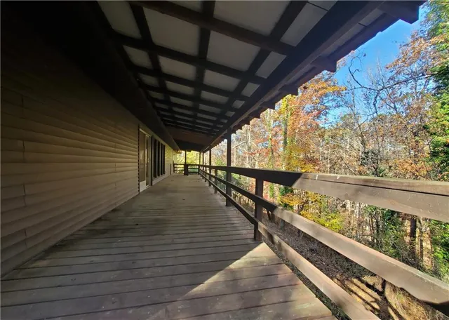 a view of a backyard with large trees