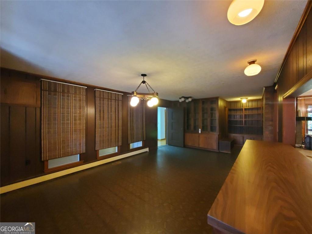 1116 Cody Road Mount Airy, GA 30563 - Photo 35 of 39 an empty room with wooden floor and windows