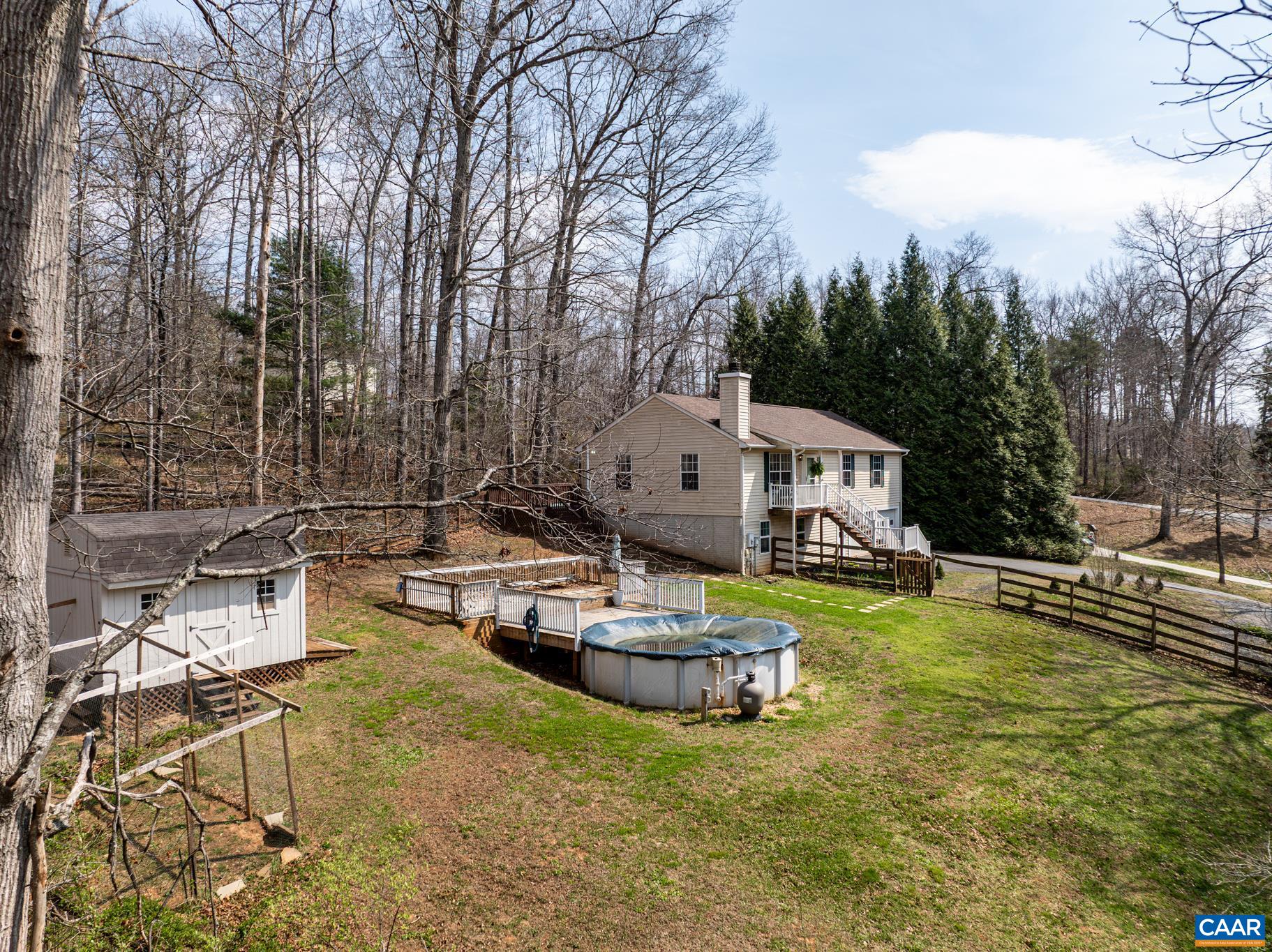 1029 West Daffodil Road Ruckersville, VA 22968 - Photo 11 of 39 a view of a house with swimming pool and sitting area