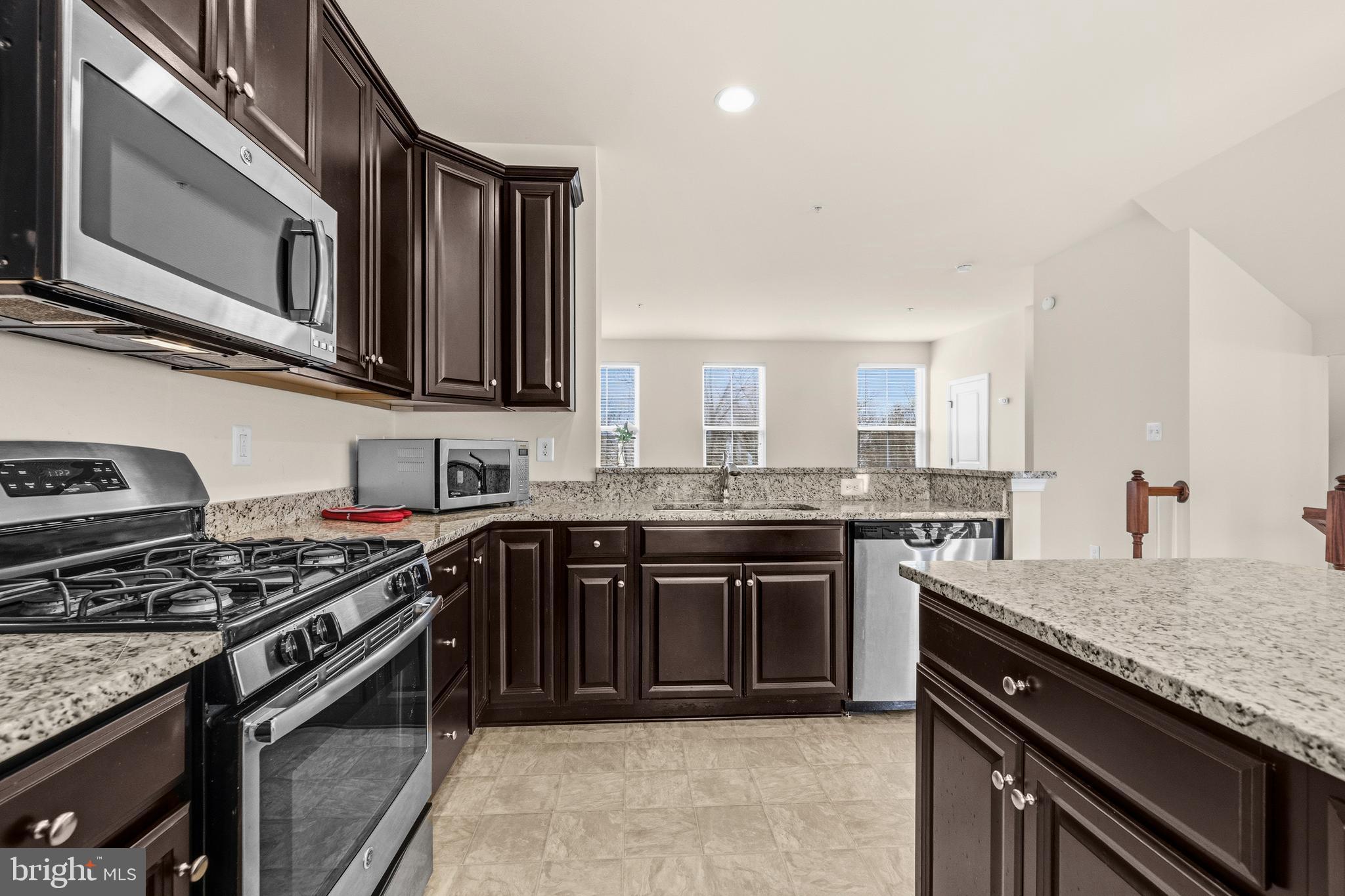 617 Potomac View Parkway Brunswick, MD 21716 - Photo 7 of 48 a kitchen with stainless steel appliances granite countertop a stove and a sink