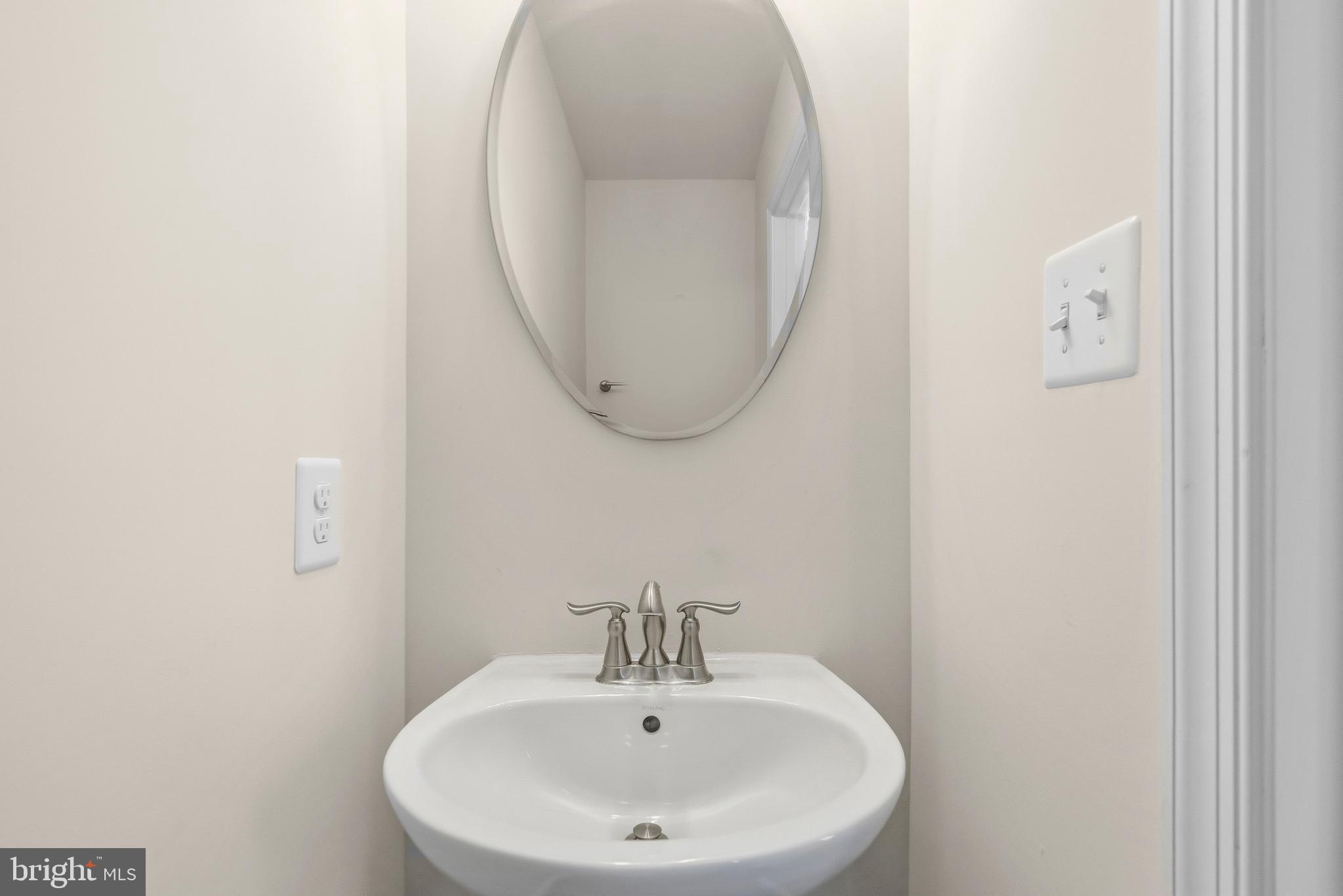 617 Potomac View Parkway Brunswick, MD 21716 - Photo 9 of 48 a bathroom with a sink and a mirror