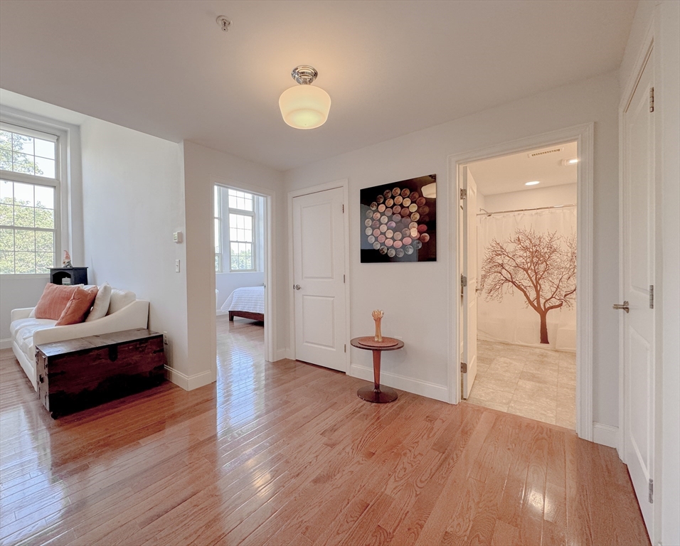 18 Eagle Nest Road, Unit 331 Clinton, MA 01510 - Photo 11 of 28 a living room with furniture and a wooden floor