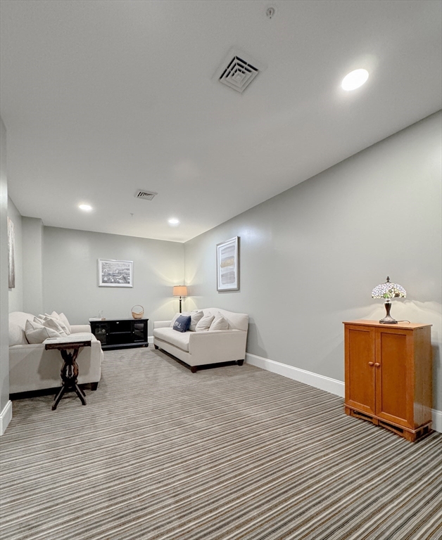 18 Eagle Nest Road, Unit 331 Clinton, MA 01510 - Photo 19 of 28 a living room with furniture and a table