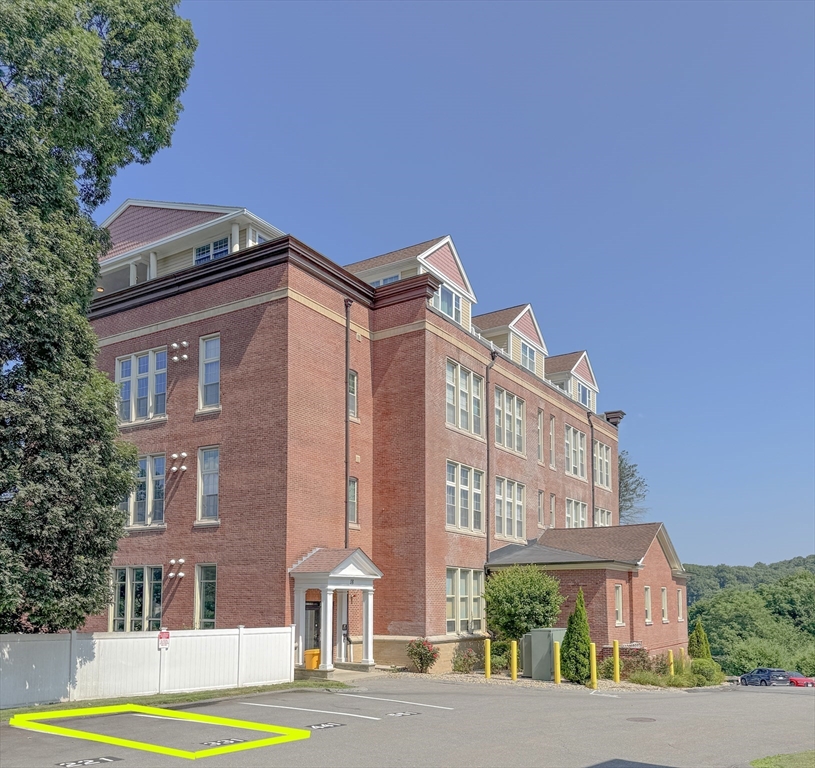 18 Eagle Nest Road, Unit 331 Clinton, MA 01510 - Photo 24 of 28 a view of a building with a yard