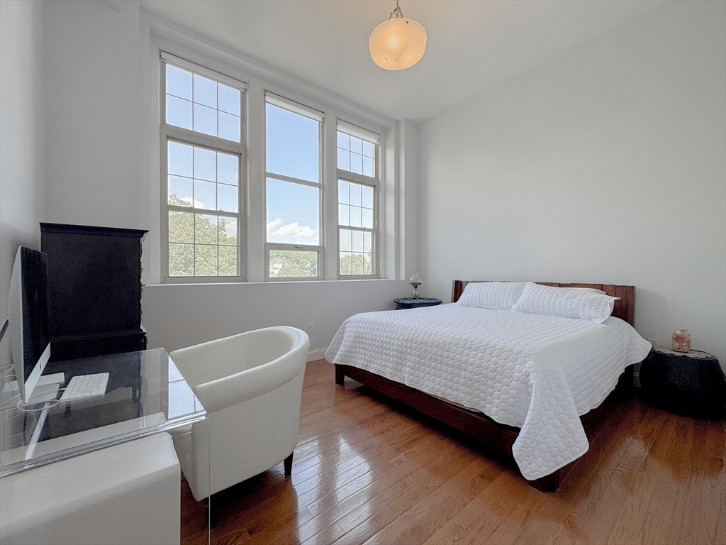 18 Eagle Nest Road, Unit 331 Clinton, MA 01510 - Photo 27 of 28 a bedroom with a bed and a chair