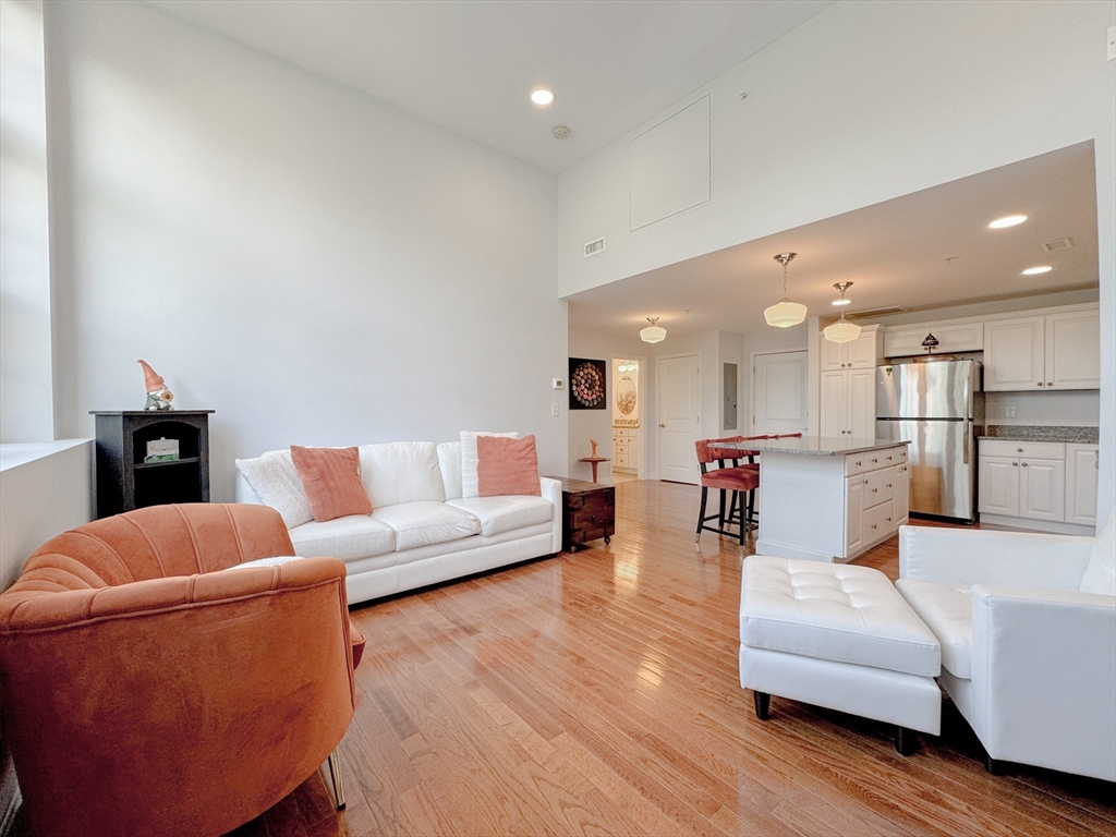 18 Eagle Nest Road, Unit 331 Clinton, MA 01510 - Photo 5 of 28 a living room with furniture and kitchen view