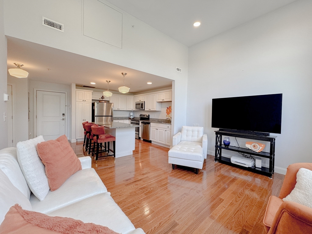 18 Eagle Nest Road, Unit 331 Clinton, MA 01510 - Photo 6 of 28 a living room with furniture and a flat screen tv