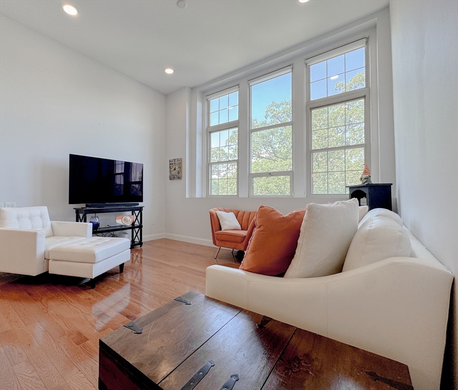 18 Eagle Nest Road, Unit 331 Clinton, MA 01510 - Photo 7 of 28 a living room with furniture and a flat screen tv