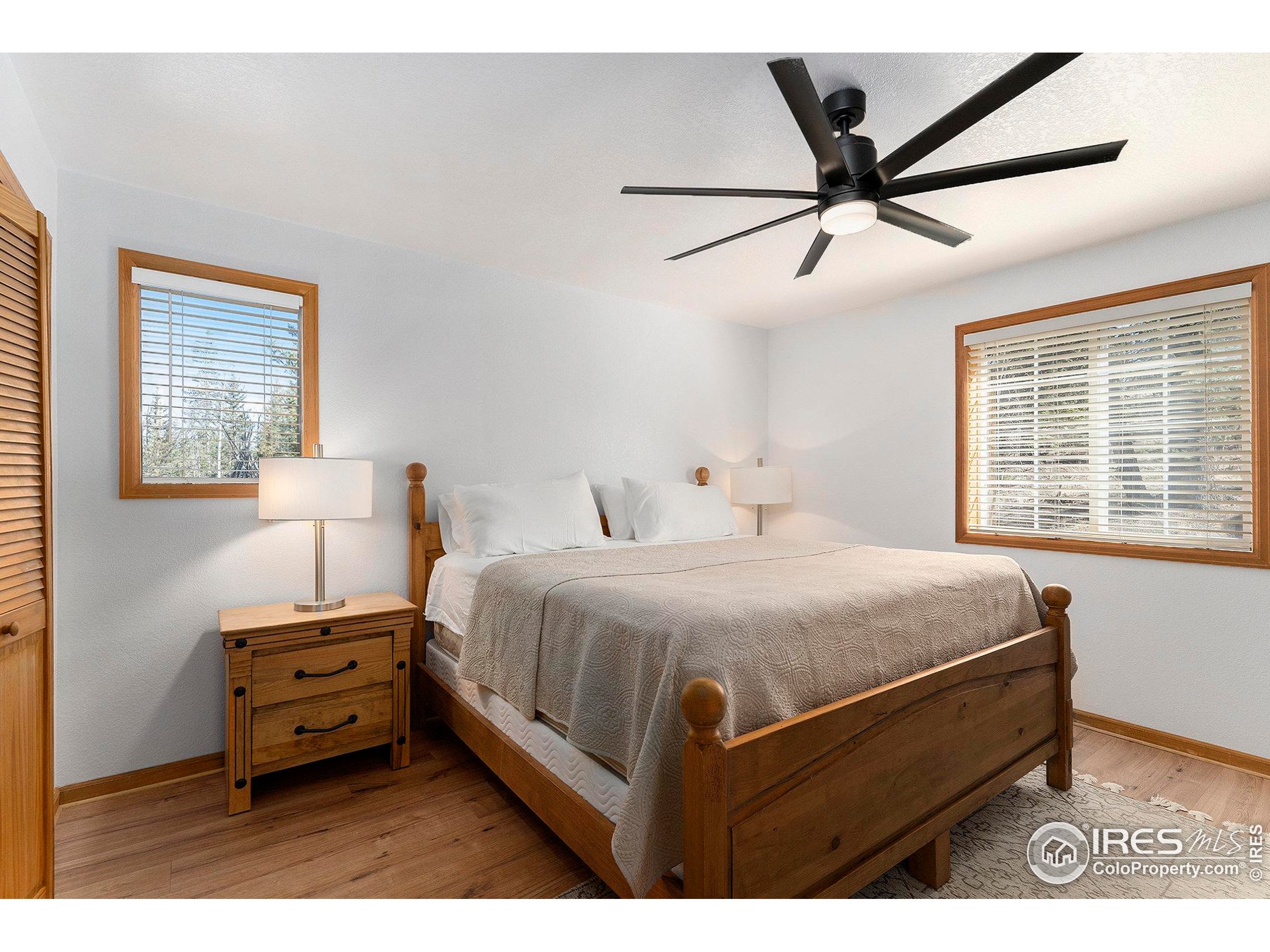 654 Piaute Way Como, CO 80432 - Photo 13 of 25 a bedroom with a bed and a window