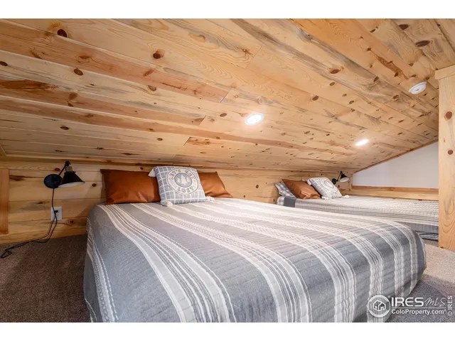 a bedroom with bed and window