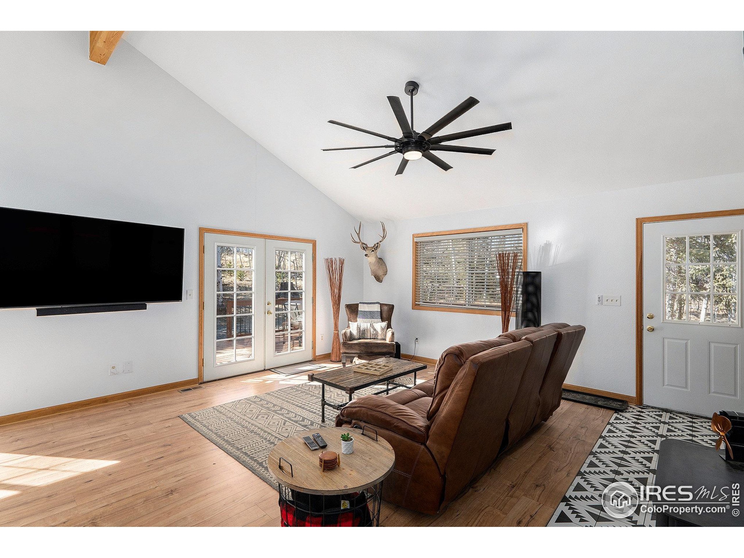 654 Piaute Way Como, CO 80432 - Photo 6 of 25 a living room with furniture and a flat screen tv
