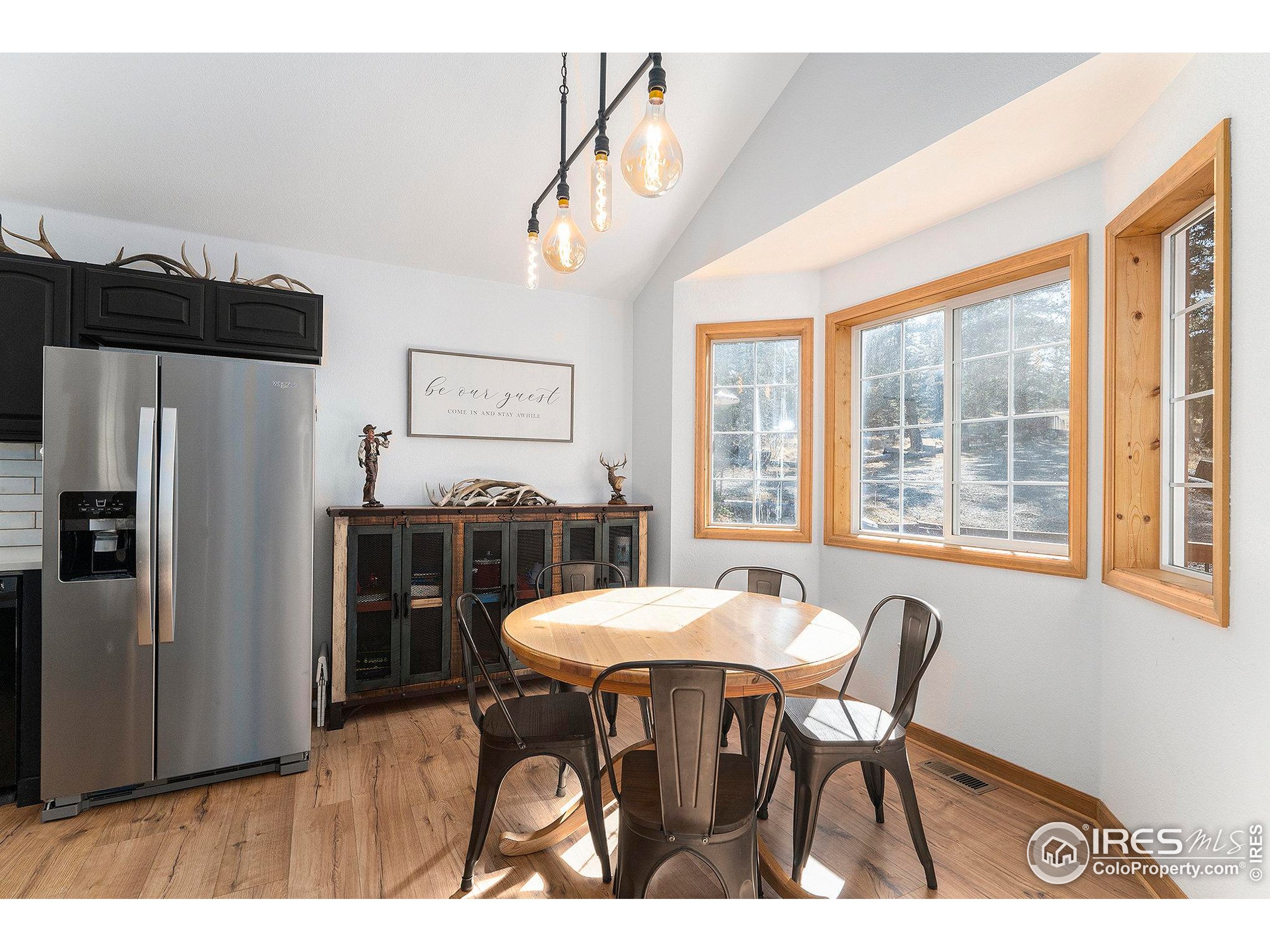 654 Piaute Way Como, CO 80432 - Photo 8 of 25 a view of a dining room with furniture window and outside view