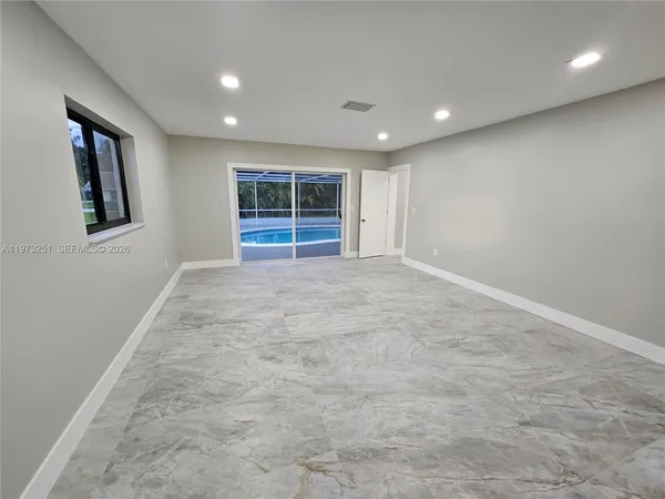 an empty room with windows