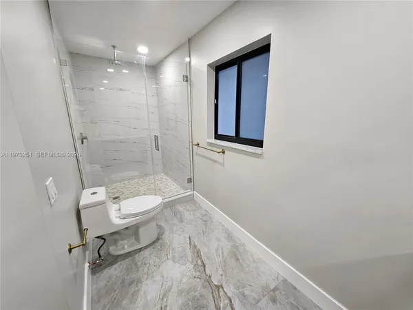 a view of a house with a sink and wooden floor