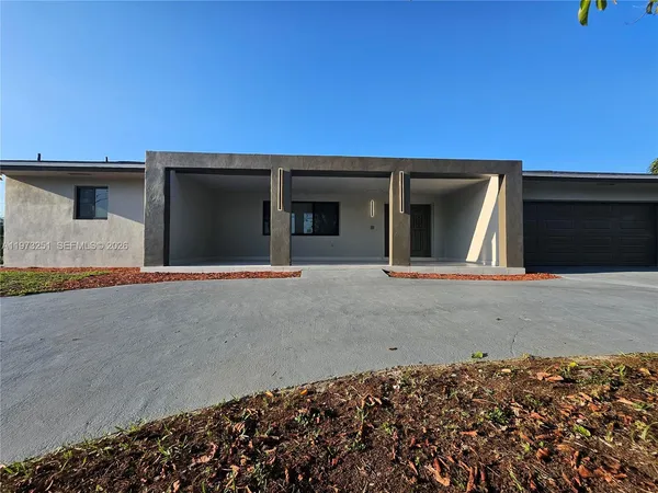 a house with trees in the background