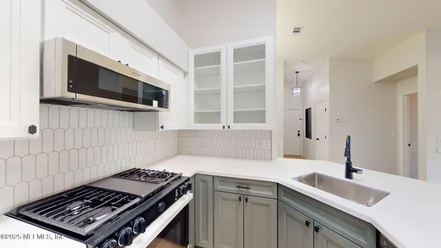 a kitchen with a stove and a microwave