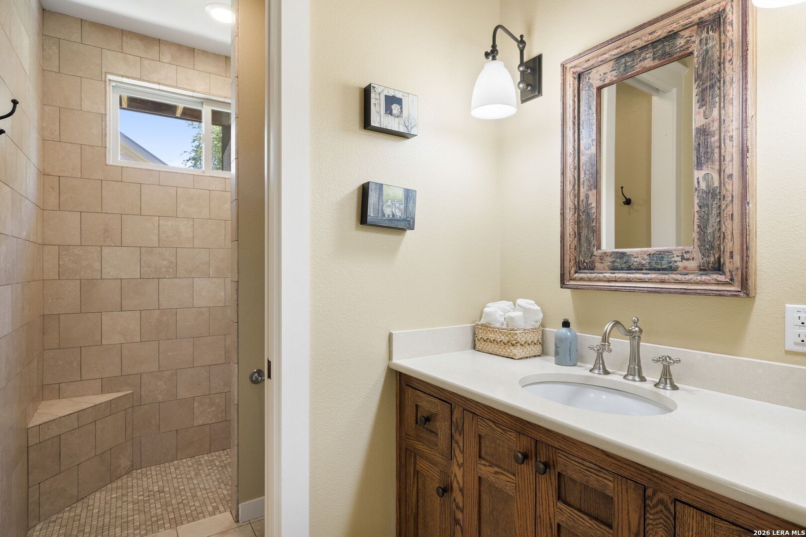 7855 Middle Creek Road Blanco, TX 78606 - Photo 25 of 57 a bathroom with a sink and a mirror