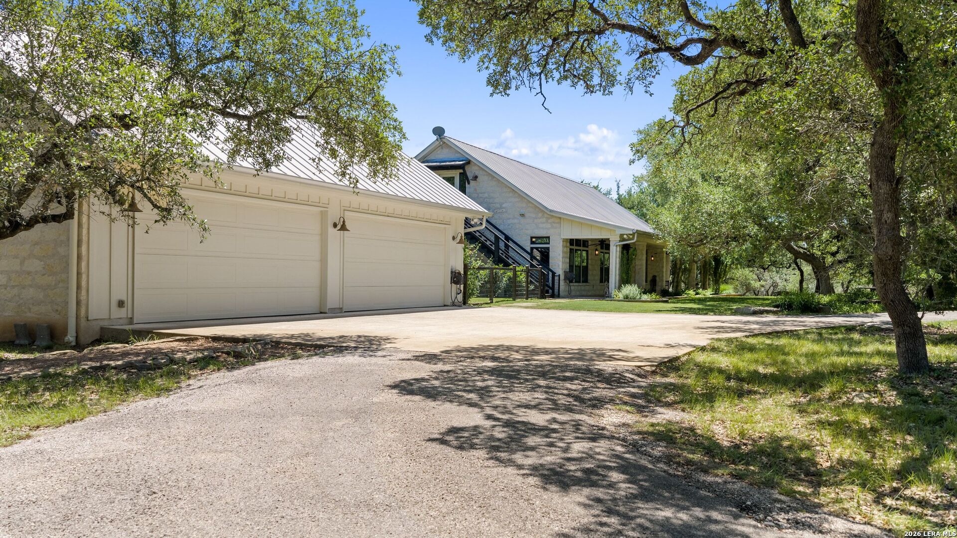 7855 Middle Creek Road Blanco, TX 78606 - Photo 30 of 57 a front view of a house with a yard and garage