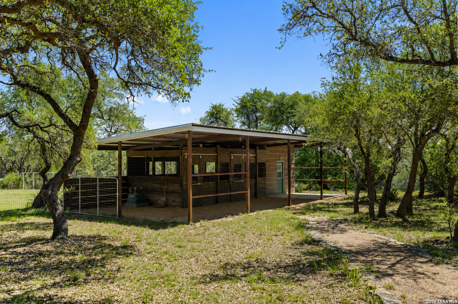 7855 Middle Creek Road Blanco, TX 78606 - Photo 31 of 57 a front view of a house with garden
