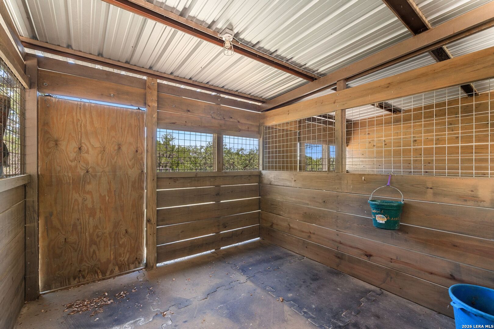 7855 Middle Creek Road Blanco, TX 78606 - Photo 32 of 57 a view of outdoor space and wooden shelves