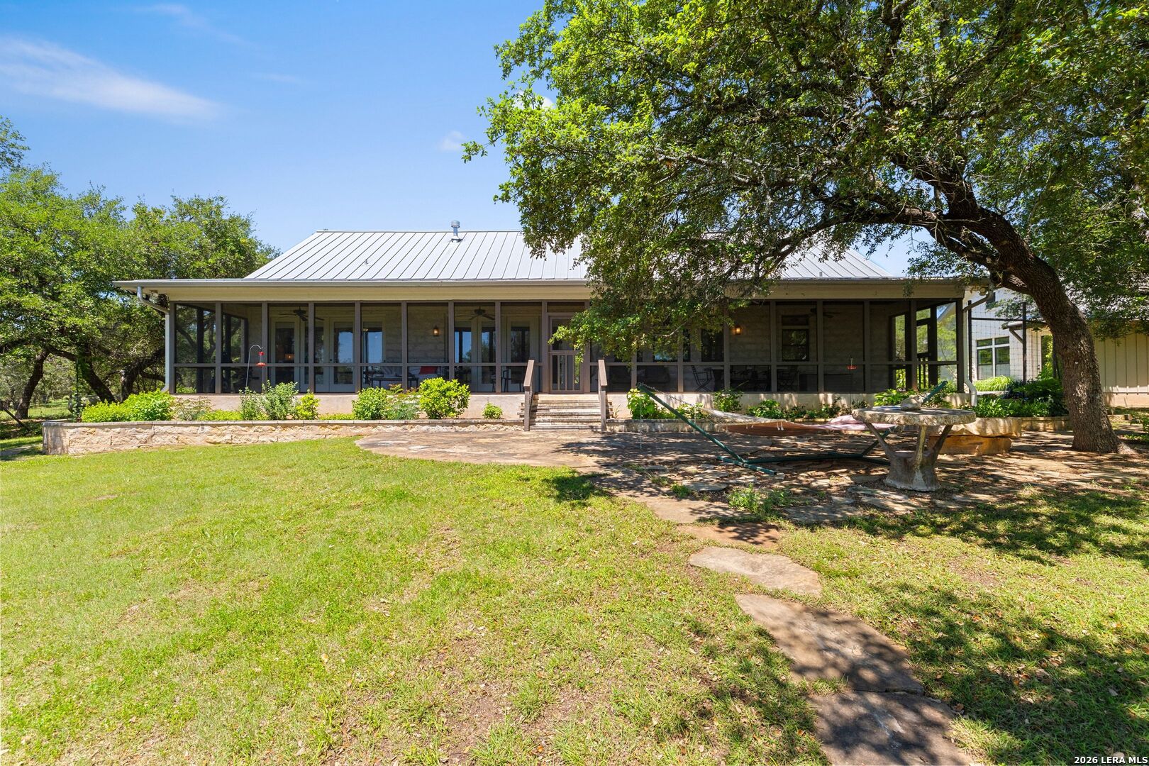 7855 Middle Creek Road Blanco, TX 78606 - Photo 35 of 57 a front view of a house with swimming pool and patio