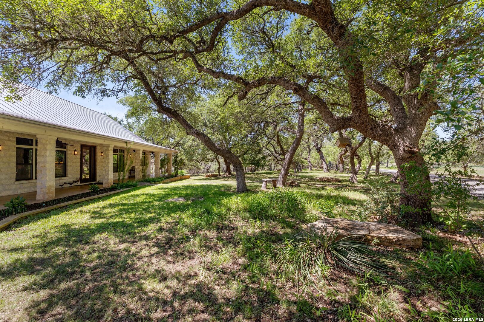 7855 Middle Creek Road Blanco, TX 78606 - Photo 50 of 57 a view of a house with backyard and sitting area