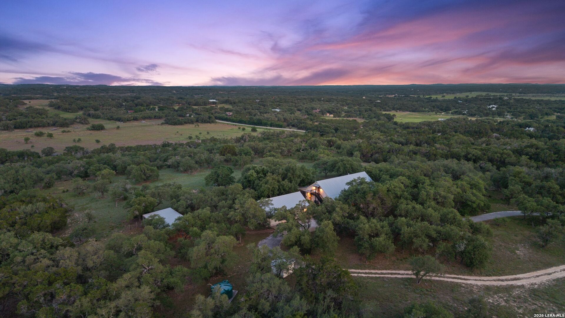 7855 Middle Creek Road Blanco, TX 78606 - Photo 5 of 57 a view of a city with lush green forest