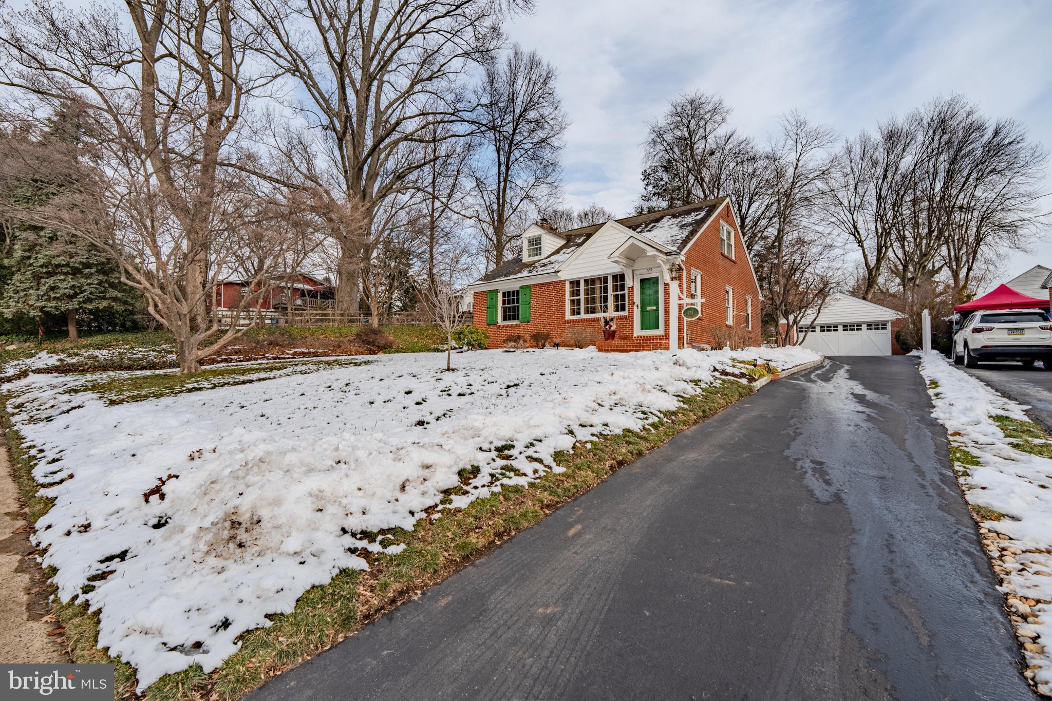 173 Hillview Drive Springfield, PA 19064 - Photo 2 of 50 a front view of a house with a yard covered in snow