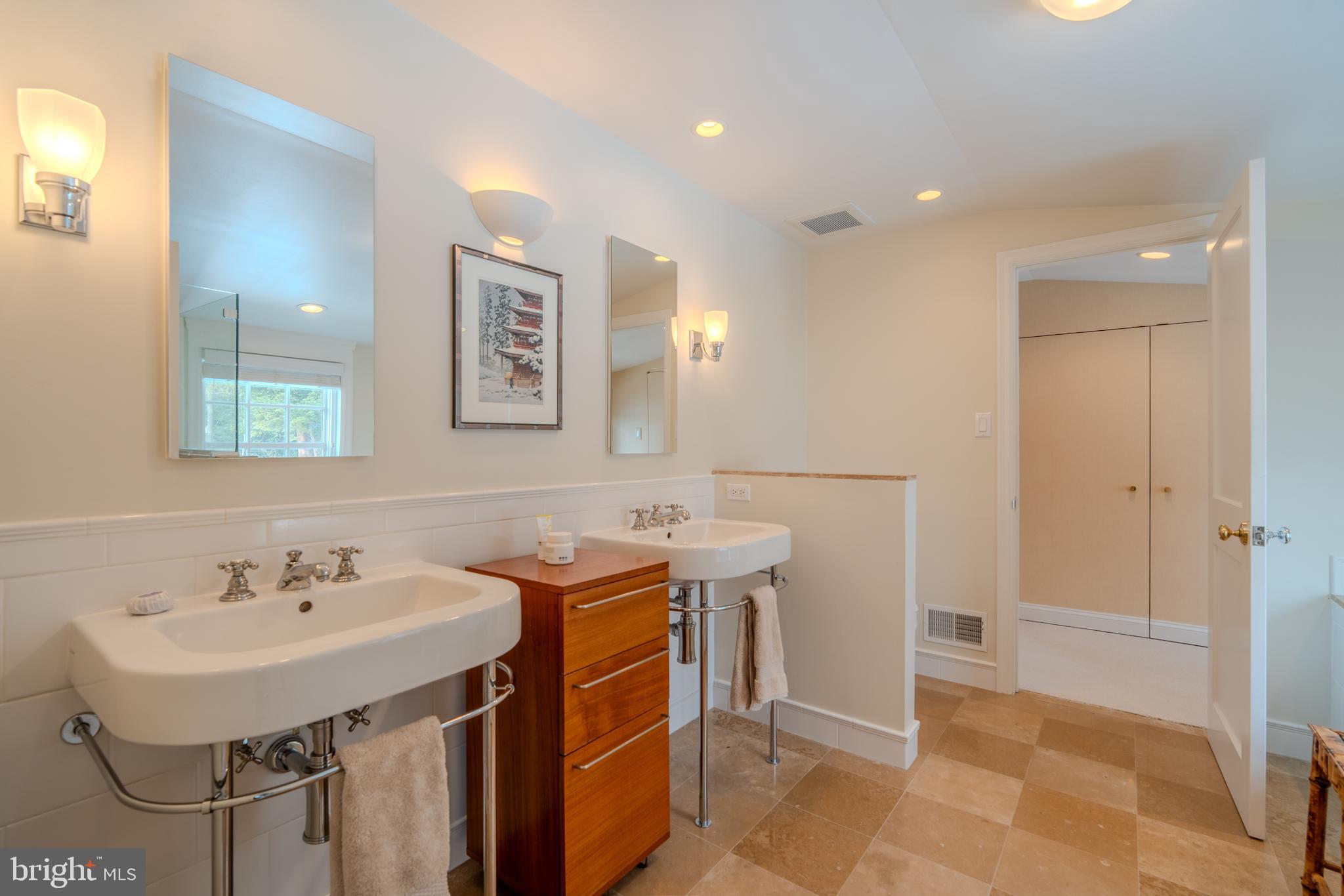 173 Hillview Drive Springfield, PA 19064 - Photo 21 of 50 a view of a bathroom with a sink and mirror
