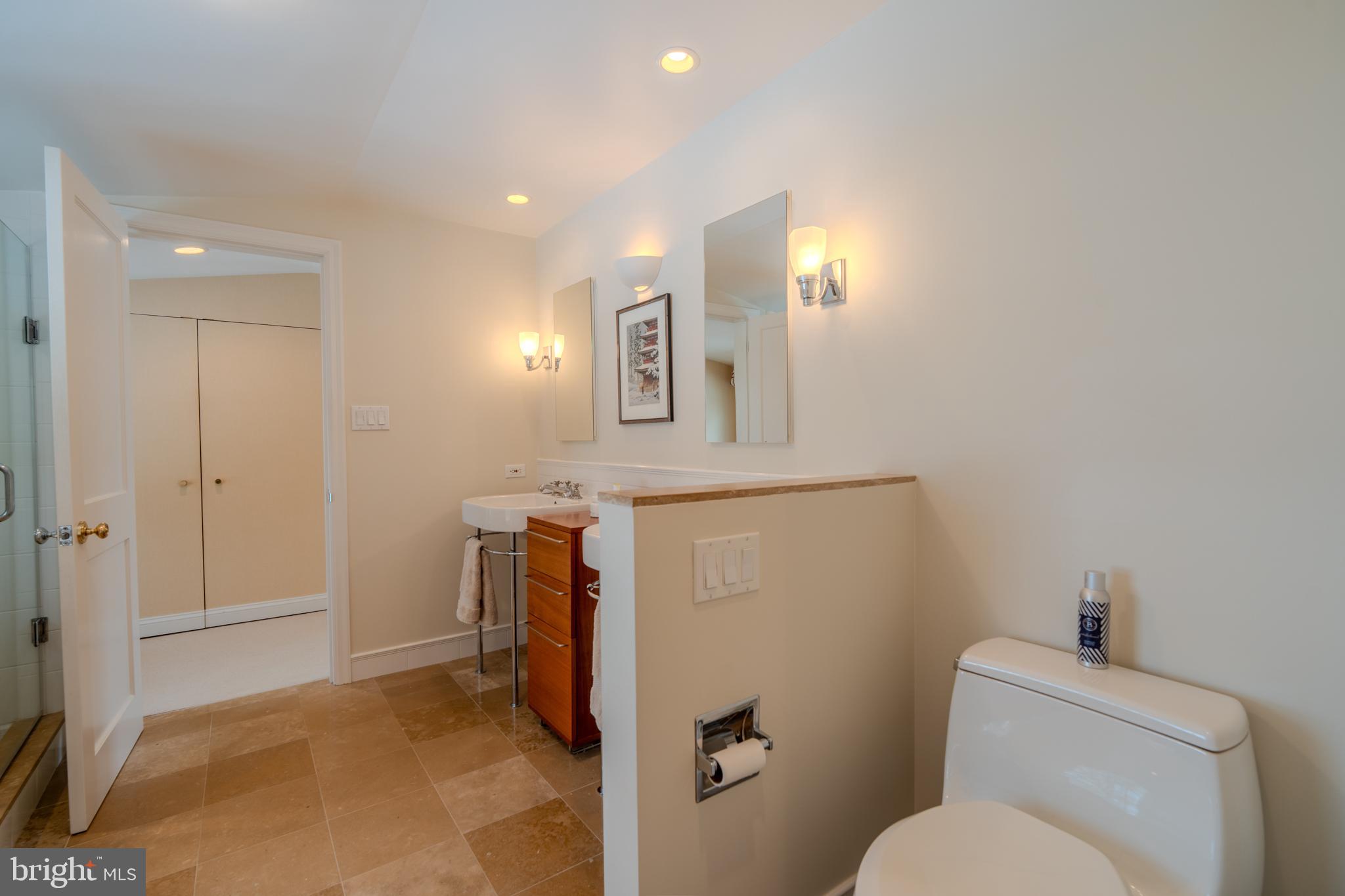 173 Hillview Drive Springfield, PA 19064 - Photo 22 of 50 a bathroom with a toilet sink and mirror