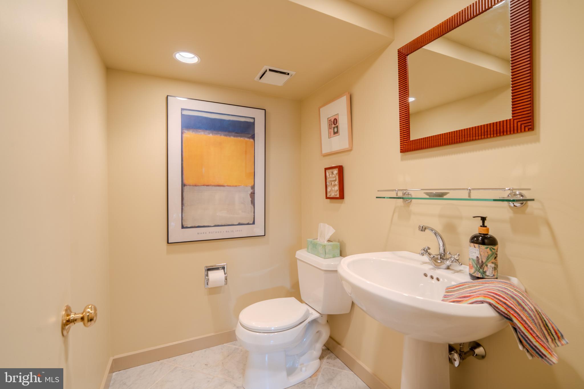173 Hillview Drive Springfield, PA 19064 - Photo 32 of 50 a bathroom with a sink and mirror with toilet