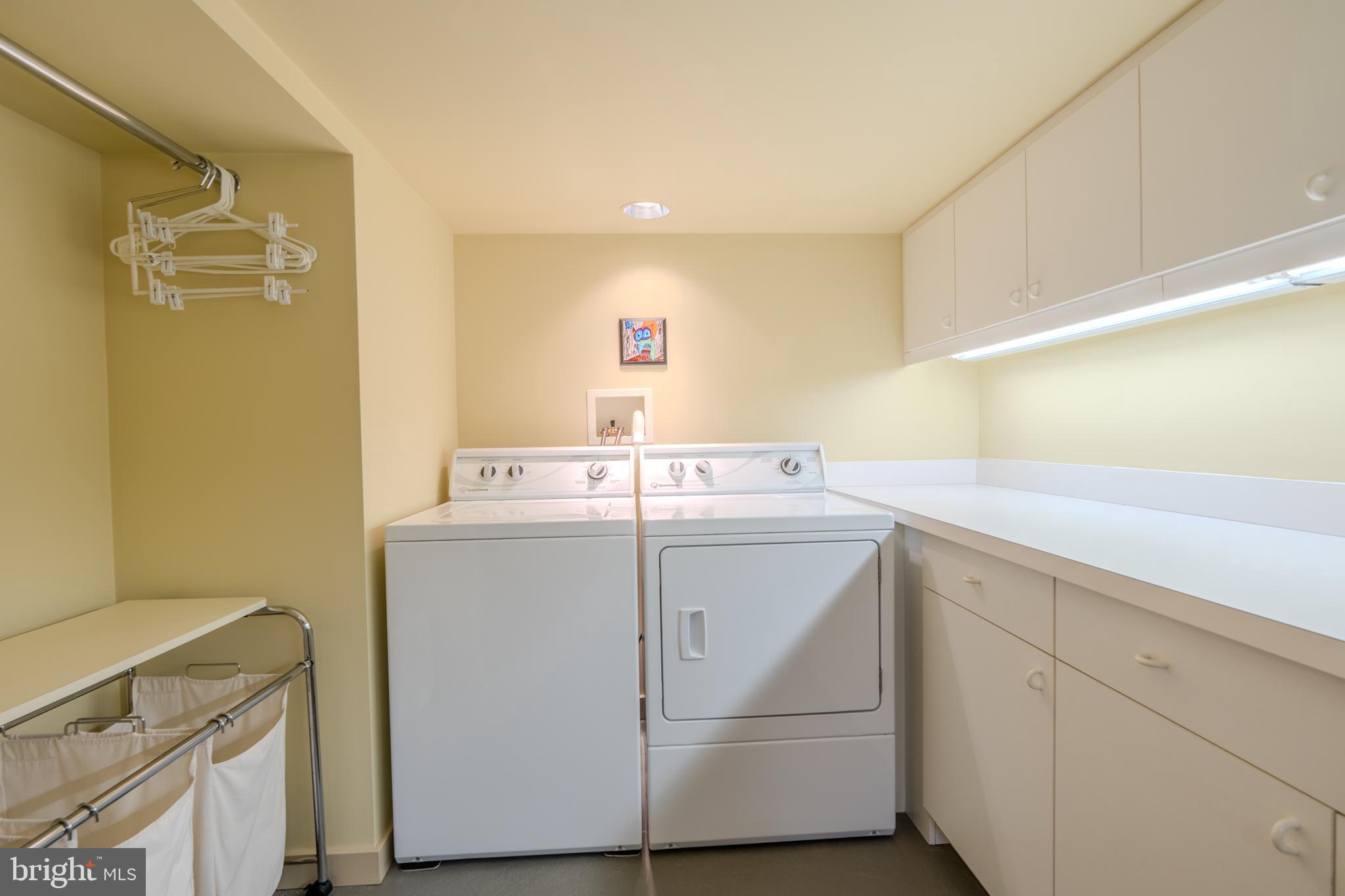 173 Hillview Drive Springfield, PA 19064 - Photo 34 of 50 a utility room with cabinets washer and dryer