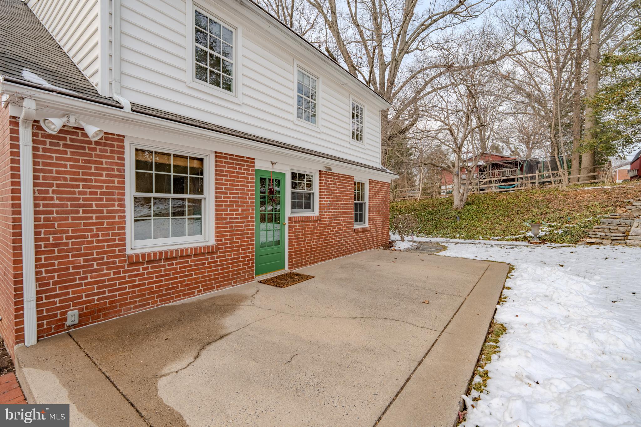 173 Hillview Drive Springfield, PA 19064 - Photo 37 of 50 a backyard of a house with large trees and barbeque oven
