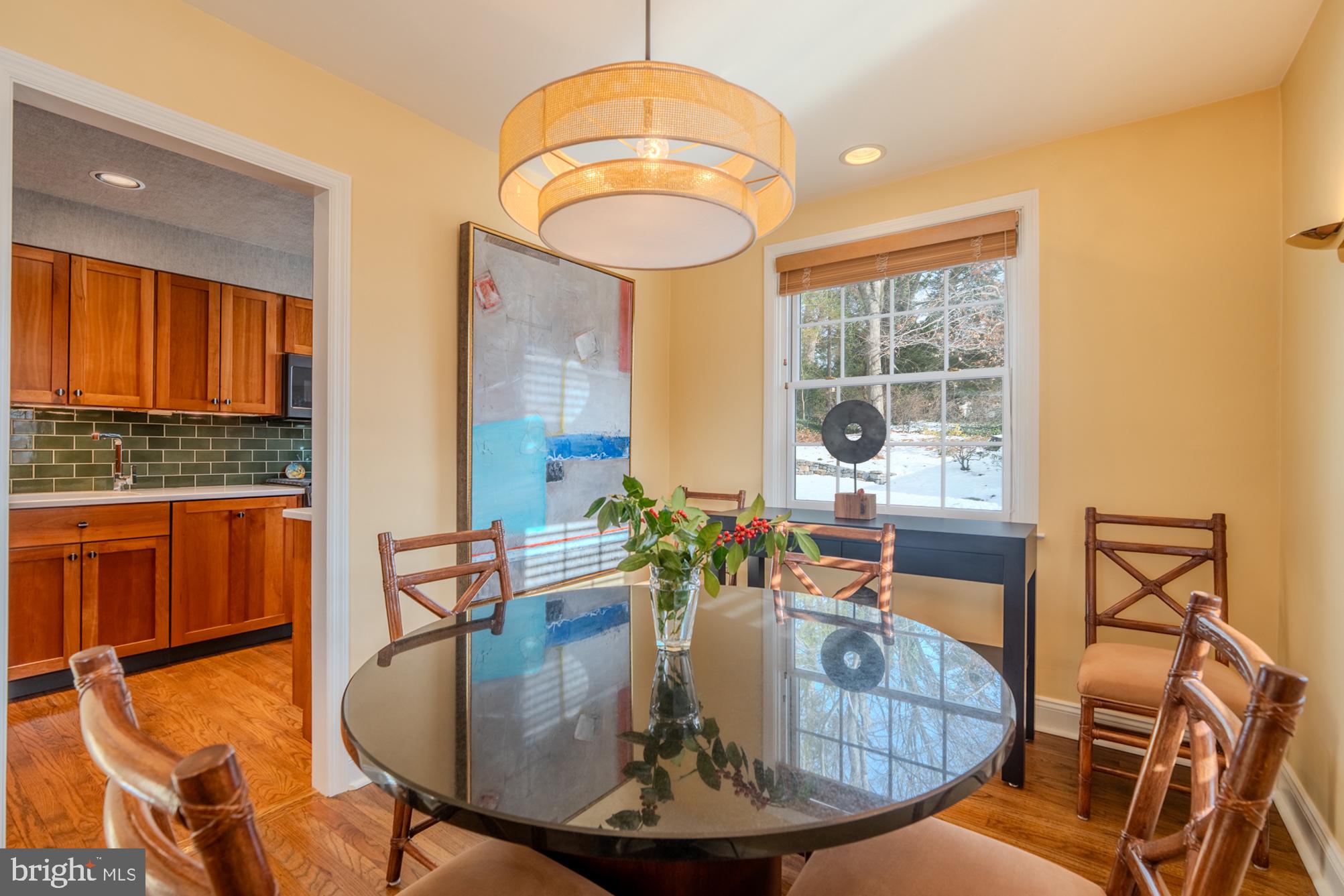 173 Hillview Drive Springfield, PA 19064 - Photo 6 of 50 a dining room with furniture a large window and wooden floor