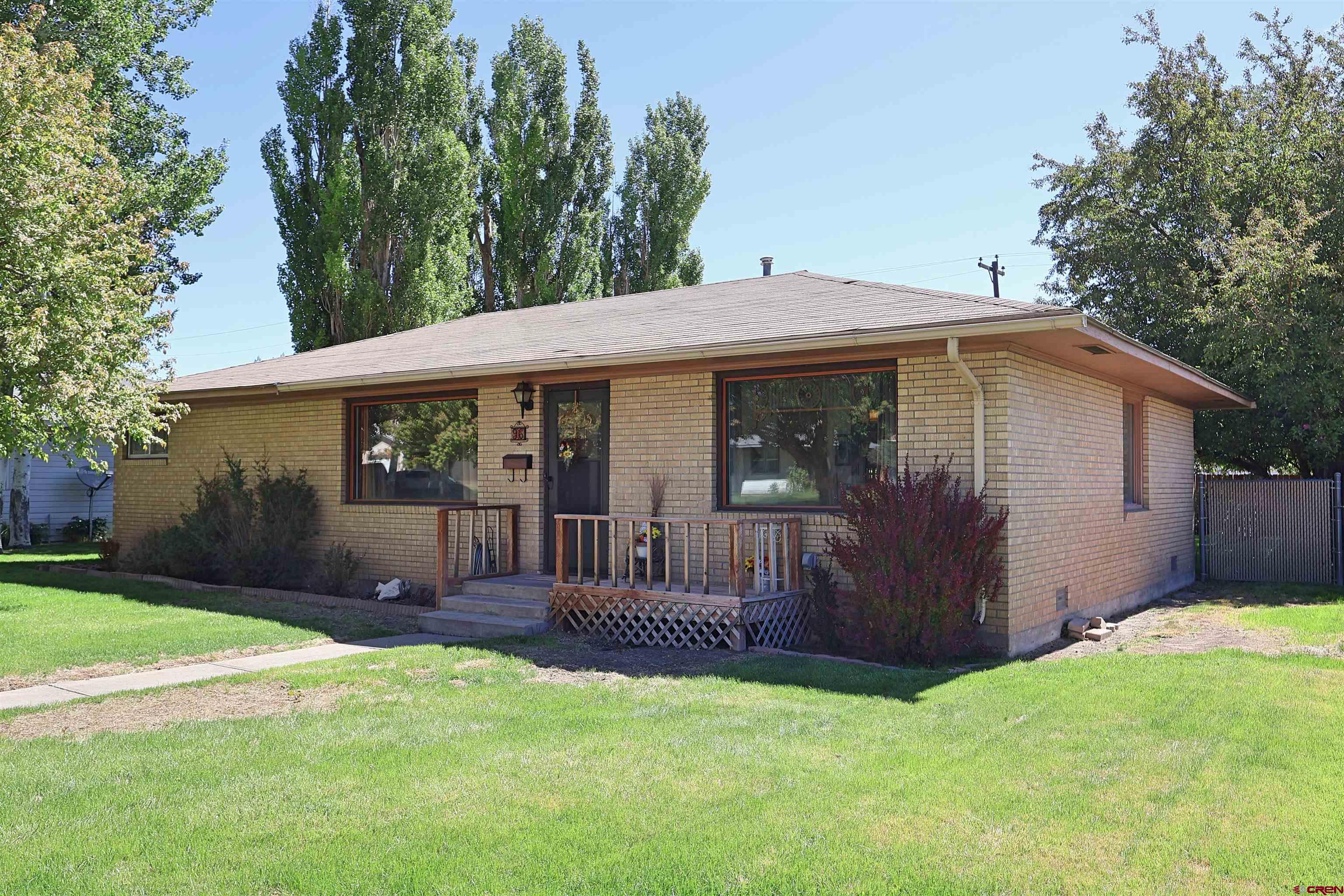 96 El Rio Drive Alamosa, CO 81101 - Photo 1 of 18 a view of a house with backyard porch and porch