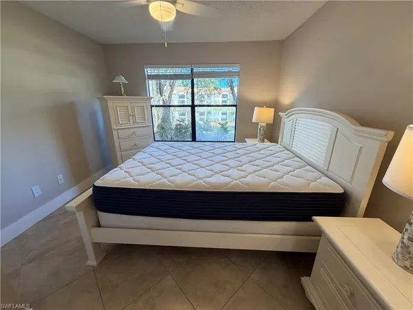 a room with a bed and a window