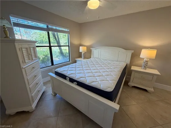 a room with a bed and a night stand