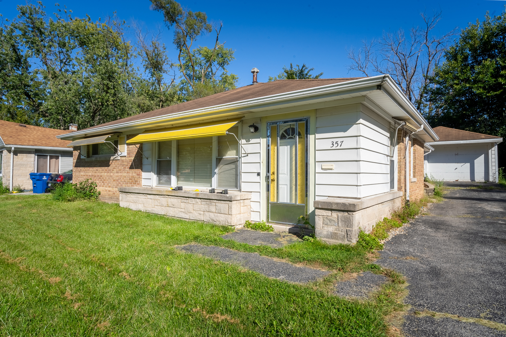 a view of a house with a yard porch and sitting area