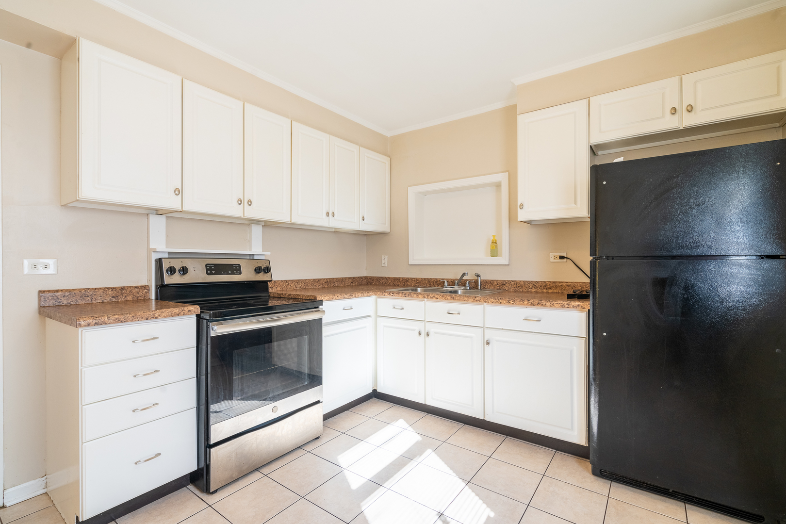 357 Neola Street Park Forest, IL 60466 - Photo 11 of 22 a kitchen with granite countertop white cabinets stainless steel appliances and sink