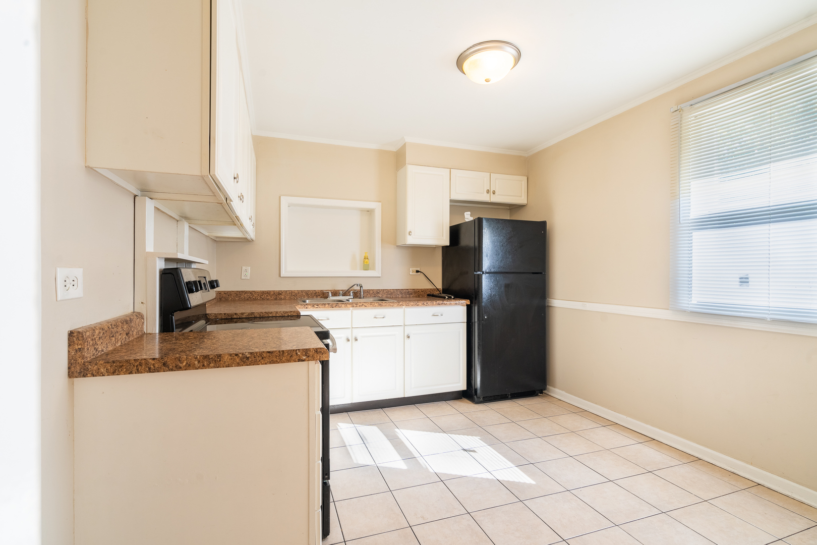 357 Neola Street Park Forest, IL 60466 - Photo 10 of 22 a kitchen with a sink stove and refrigerator