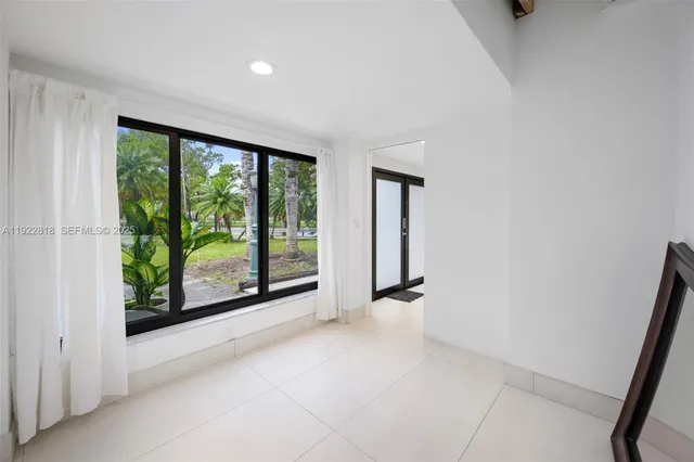a view of a room with sliding glass door and mountain view