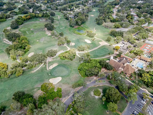 an aerial view of a house with outdoor space and street view
