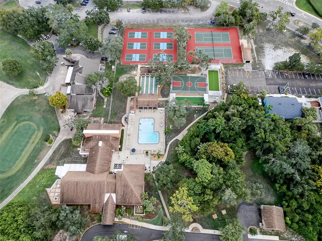 an aerial view of residential houses with outdoor space and street view