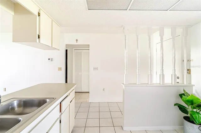 a kitchen with a sink and cabinets