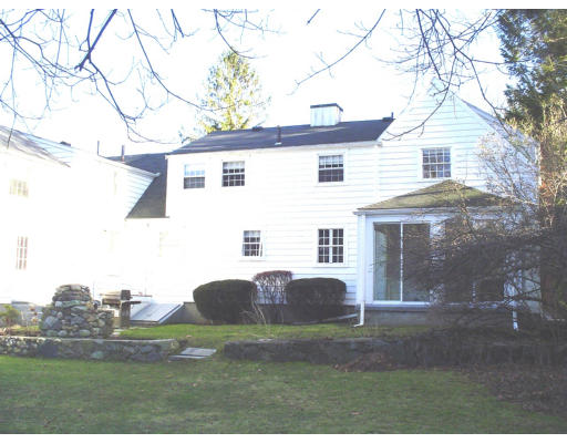 83 Clifton Road Milton, MA 02186 - Photo 2 of 5 a view of a white house with a yard