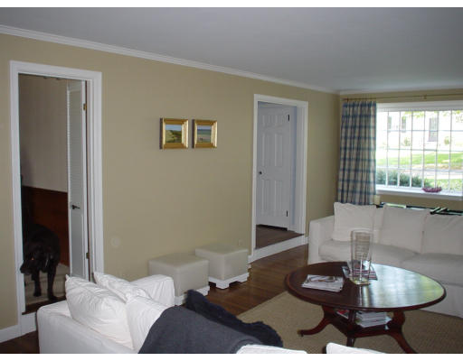 83 Clifton Road Milton, MA 02186 - Photo 4 of 5 a living room with furniture and a fireplace