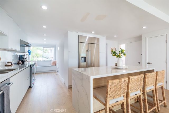a kitchen with stainless steel appliances granite countertop counter space a sink and cabinets