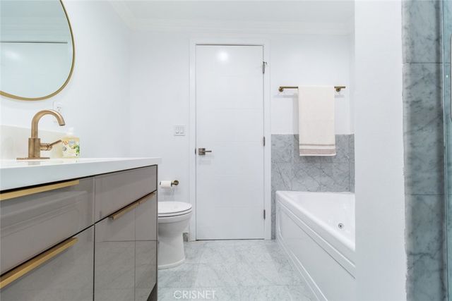 a bathroom with a sink a toilet and a bathtub