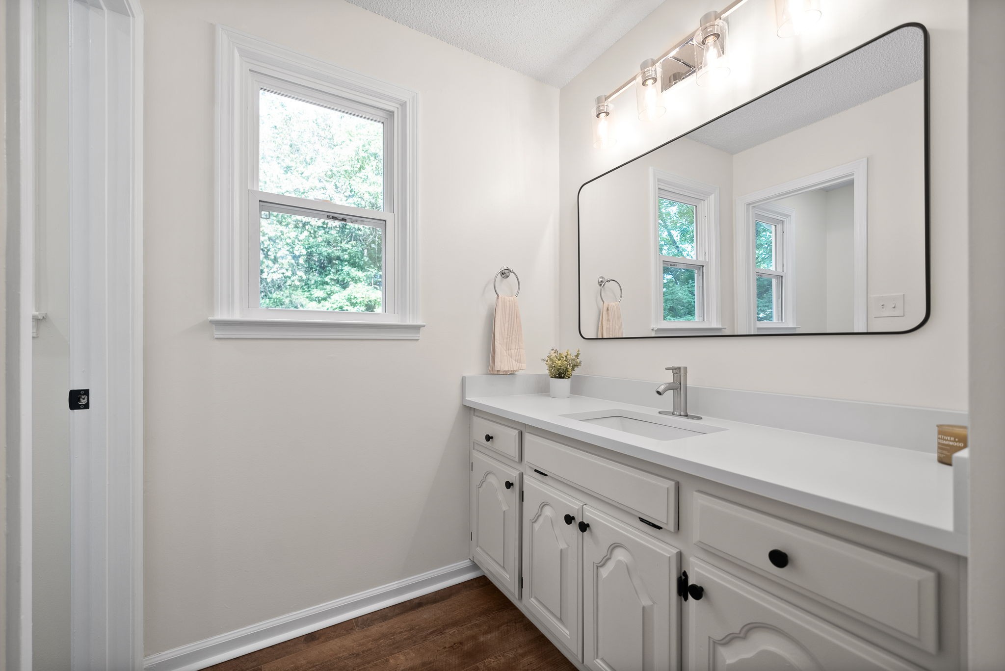 2212 Bend Road Clarksville, TN 37040 - Photo 23 of 32 a bathroom with a double vanity sink and mirror with window