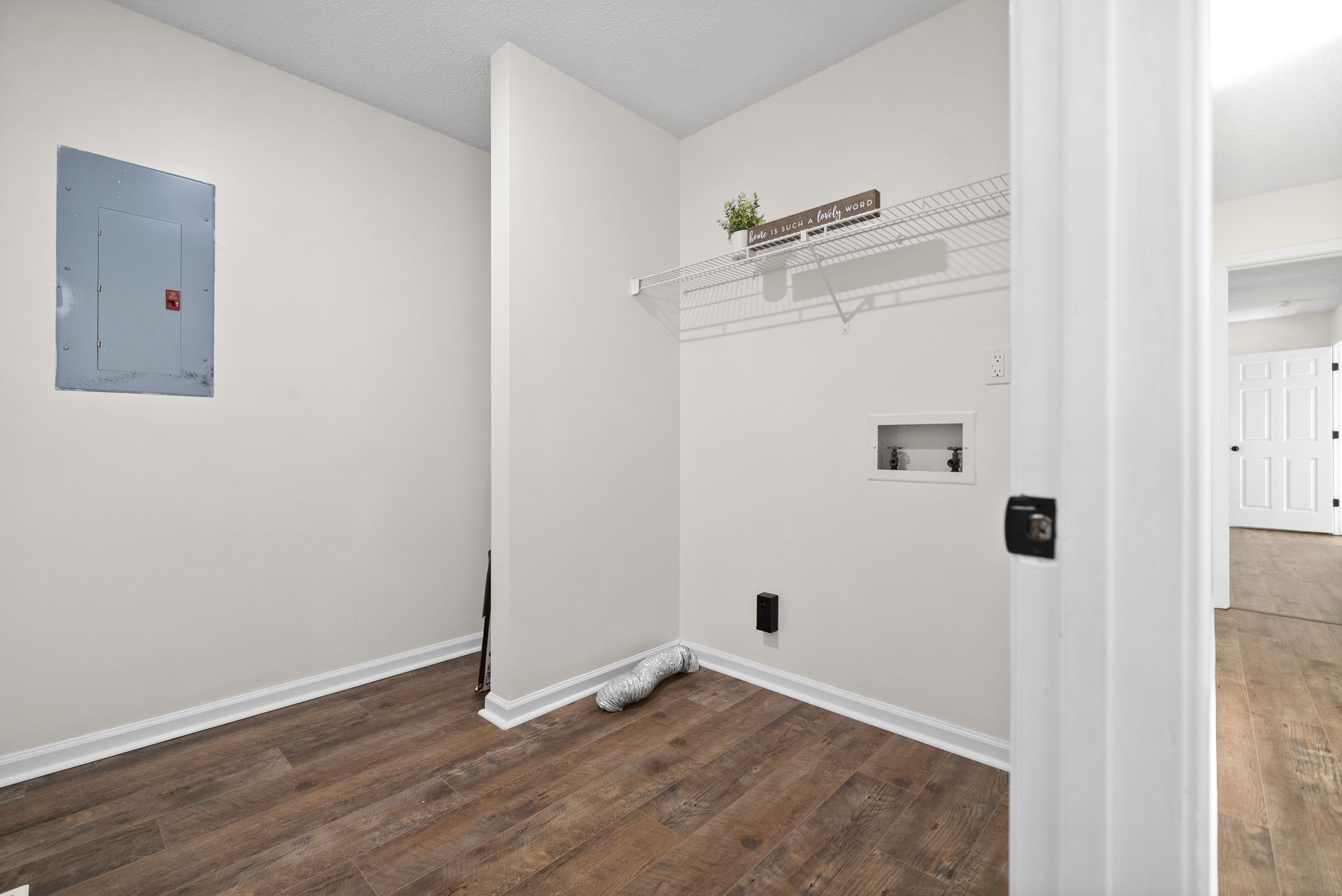 2212 Bend Road Clarksville, TN 37040 - Photo 26 of 32 an empty room with wooden floor and mirror